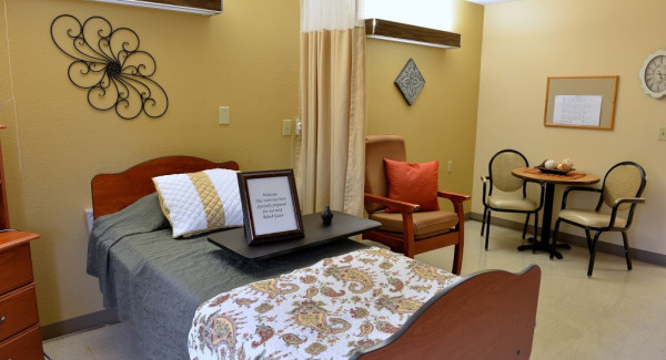 Room with bed and chairs